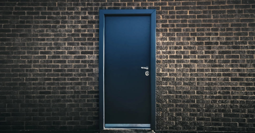 Bullet-resistant-door-embassy.webp Bullet resistant door in a brick wall