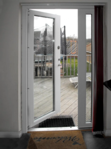 Bullet-resistant glass security door in a residential opening