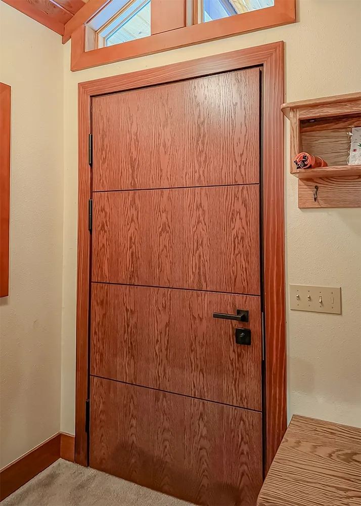 Embassy forced-entry-resistant exterior security door with oak veneer