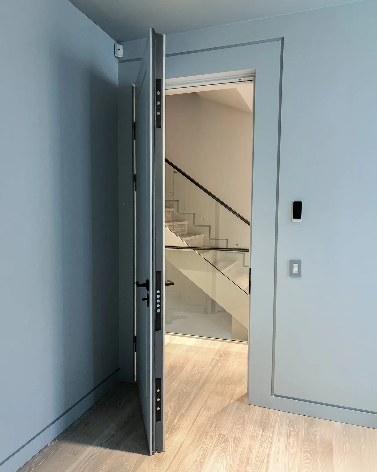 Embassy residential security door installed in a modern interior