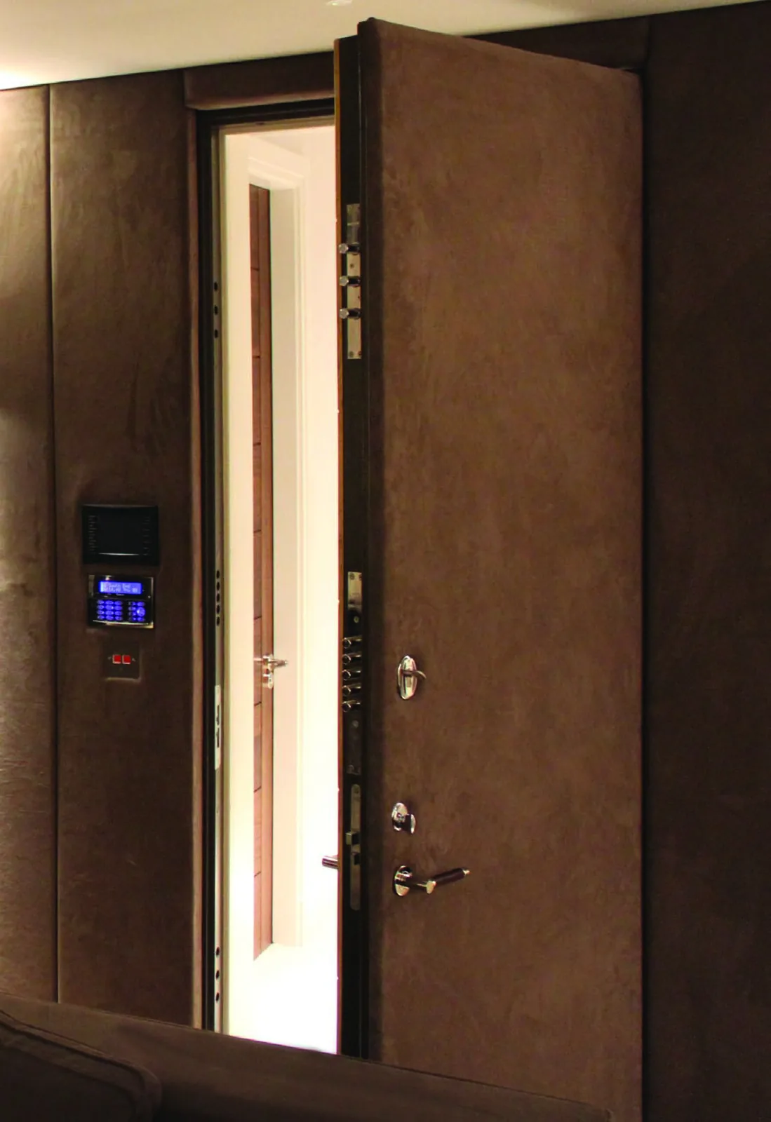 Heavy high-security door shown open to display door thickness