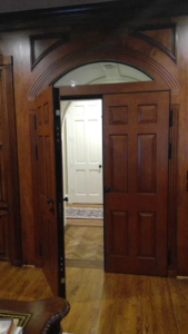 Wood double security door installed in a residential entry