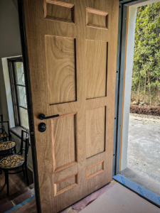Wood security door open to show multi-point locking